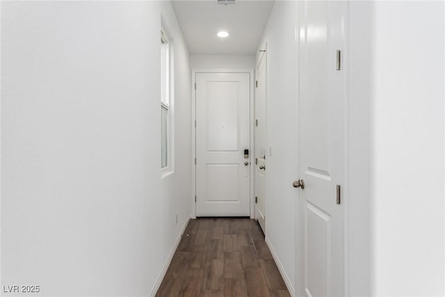 hallway featuring dark hardwood / wood-style floors