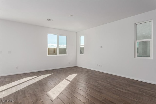 unfurnished room featuring dark hardwood / wood-style floors