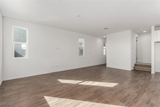 spare room with dark wood-type flooring