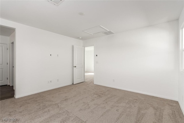 unfurnished room with light carpet