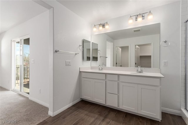 bathroom featuring vanity, hardwood / wood-style floors, and an enclosed shower