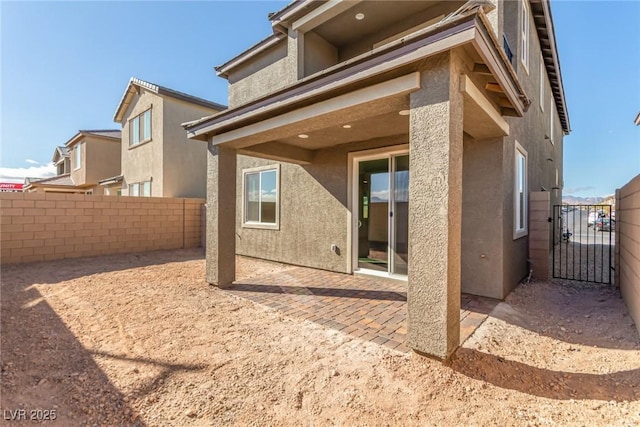 rear view of property with a patio