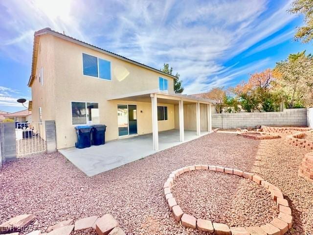 back of house featuring a patio area