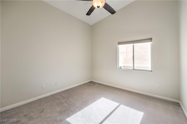 carpeted empty room featuring vaulted ceiling and ceiling fan