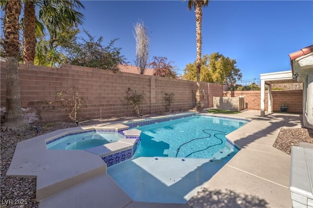 view of pool featuring a patio area, a fenced backyard, and a pool with connected hot tub