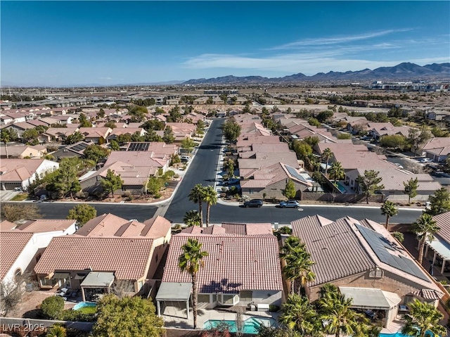 birds eye view of property with a mountain view