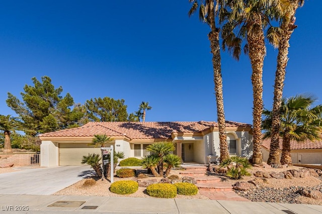 mediterranean / spanish-style house featuring a garage