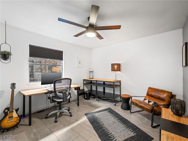 office area with ceiling fan and a textured ceiling