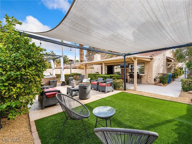 view of patio featuring a pergola, an outdoor living space with a fire pit, and a hot tub