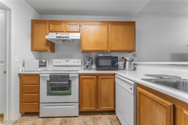 kitchen with sink and white appliances