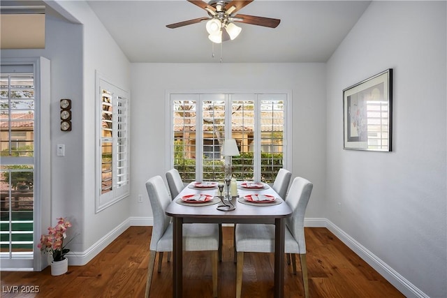 dining area featuring ceiling fan and dark hardwood / wood-style floors