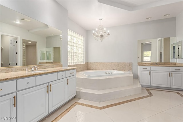 bathroom featuring tile patterned floors, vanity, and a wealth of natural light