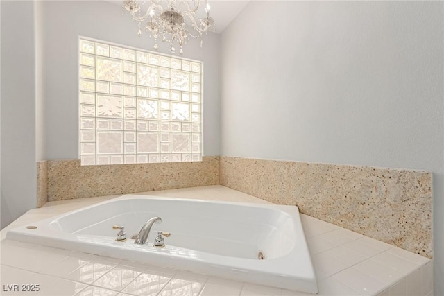 bathroom with vaulted ceiling, tiled bath, and a notable chandelier