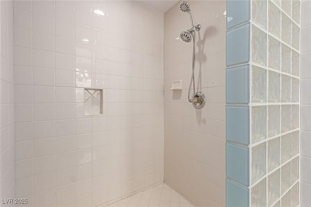 bathroom with tiled shower