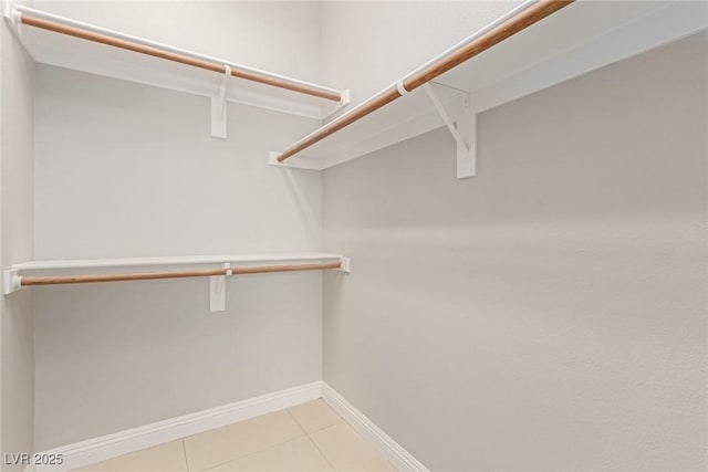 walk in closet featuring light tile patterned floors