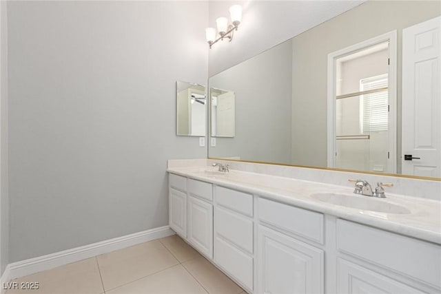 bathroom with tile patterned flooring and vanity