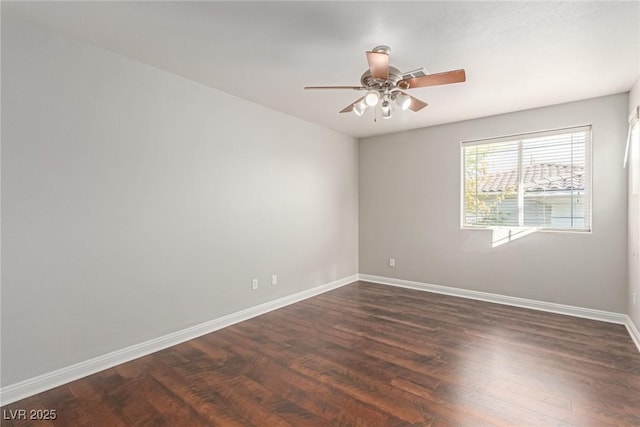 unfurnished room with ceiling fan and dark hardwood / wood-style flooring