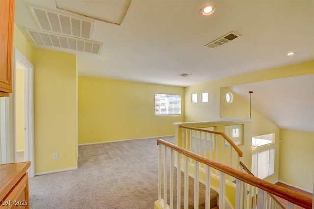 hallway with light carpet