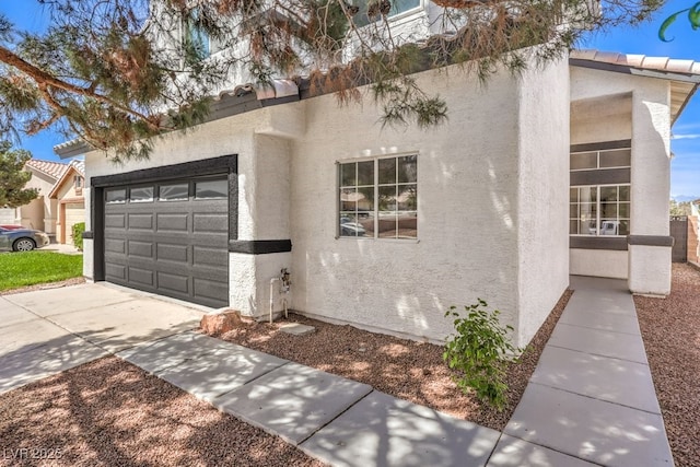 view of property exterior featuring a garage