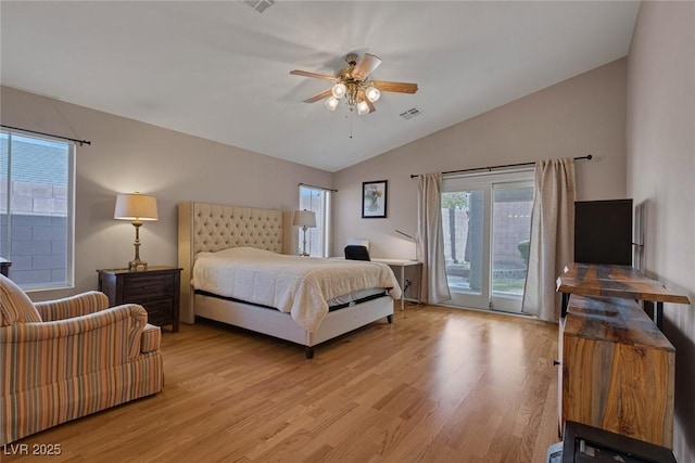 bedroom featuring vaulted ceiling, access to outside, ceiling fan, and light wood-type flooring