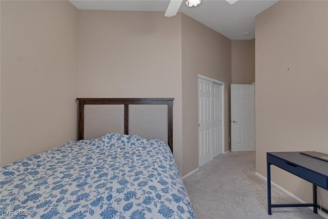 bedroom featuring ceiling fan, lofted ceiling, and light carpet