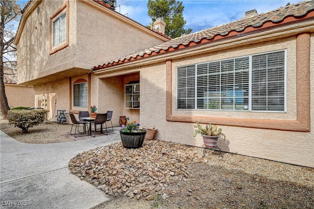 back of house with a patio area