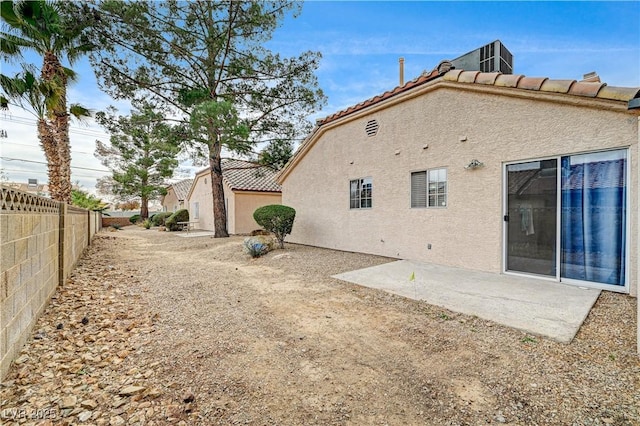 rear view of property featuring a patio area