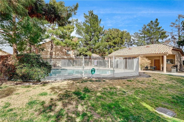 view of pool with a yard and a patio area