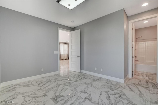 unfurnished bedroom featuring connected bathroom