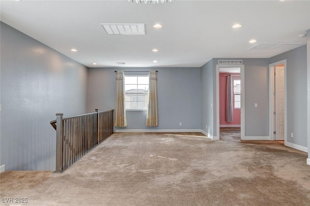 carpeted empty room featuring a healthy amount of sunlight