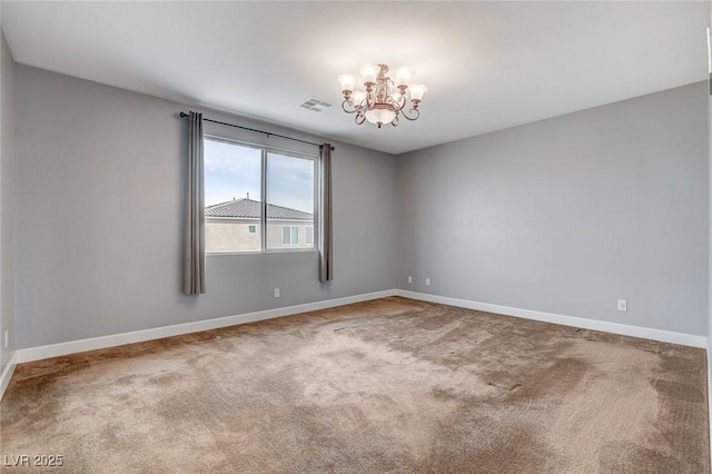 unfurnished room with carpet and a notable chandelier