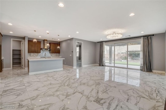 unfurnished living room with sink