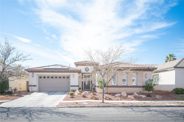 mediterranean / spanish-style house featuring a garage