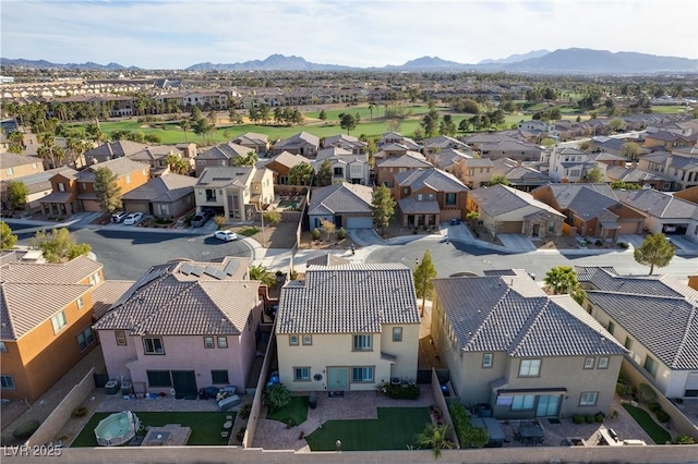 birds eye view of property with a mountain view