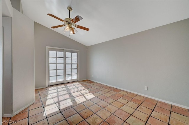 tiled empty room featuring lofted ceiling and ceiling fan