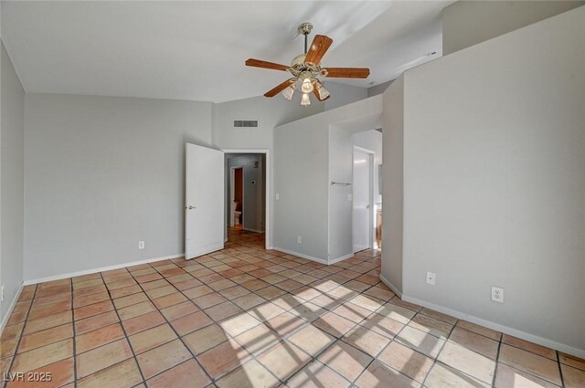 unfurnished bedroom featuring ceiling fan, vaulted ceiling, and light tile patterned floors