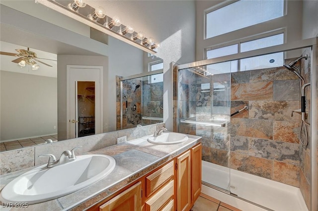 bathroom featuring vanity, tile patterned flooring, a shower with shower door, and ceiling fan