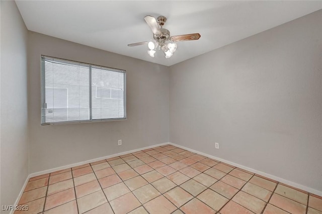 tiled empty room with ceiling fan