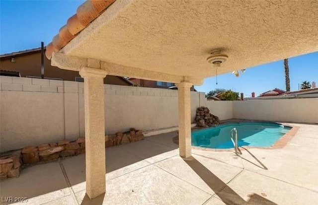 view of pool featuring a patio area