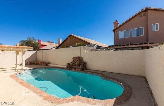 view of swimming pool with a patio area