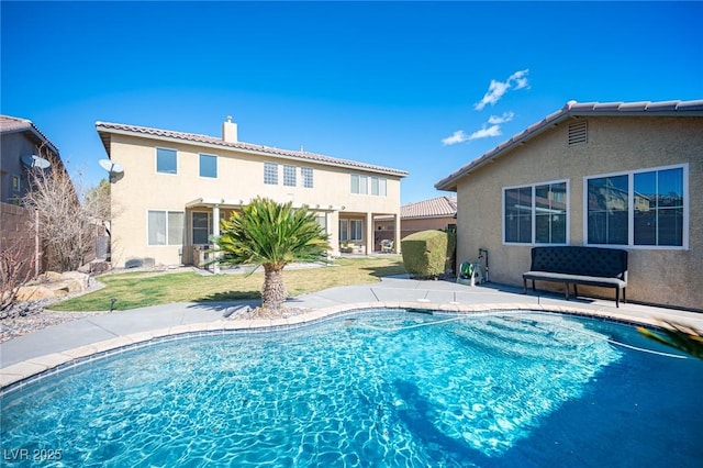 view of pool with a yard