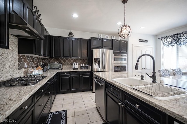 kitchen with stainless steel appliances, exhaust hood, decorative backsplash, and light tile patterned floors