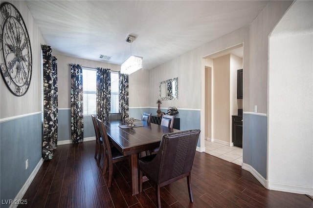 dining area with hardwood / wood-style flooring