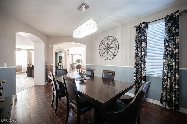 dining space featuring dark hardwood / wood-style floors