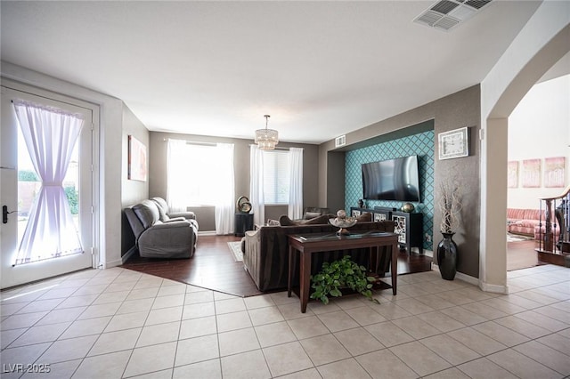 tiled living room featuring a wealth of natural light