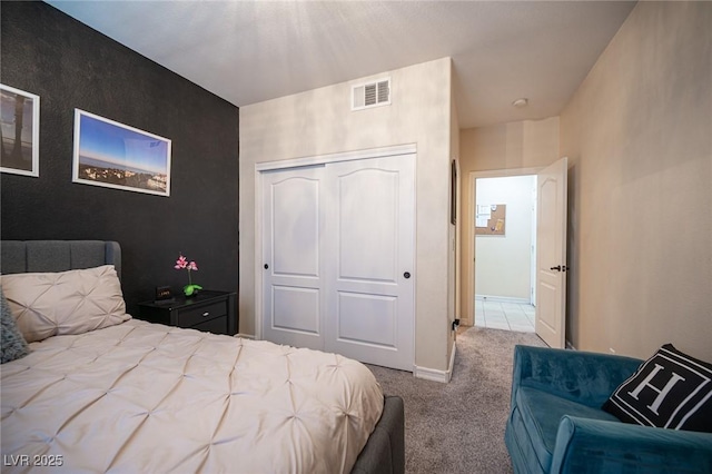 carpeted bedroom with a closet