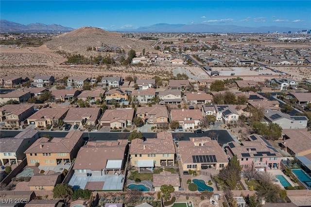 birds eye view of property featuring a mountain view