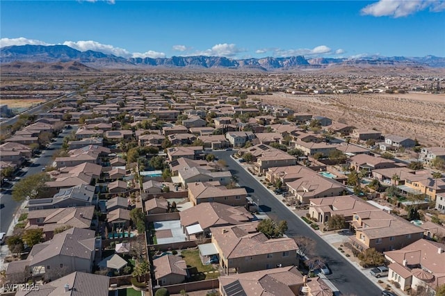 birds eye view of property with a mountain view