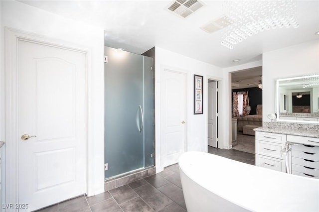 bathroom with vanity, separate shower and tub, and tile patterned floors