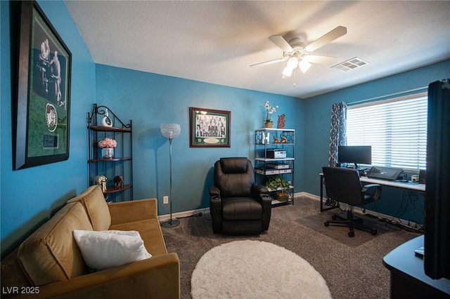 carpeted home office with ceiling fan